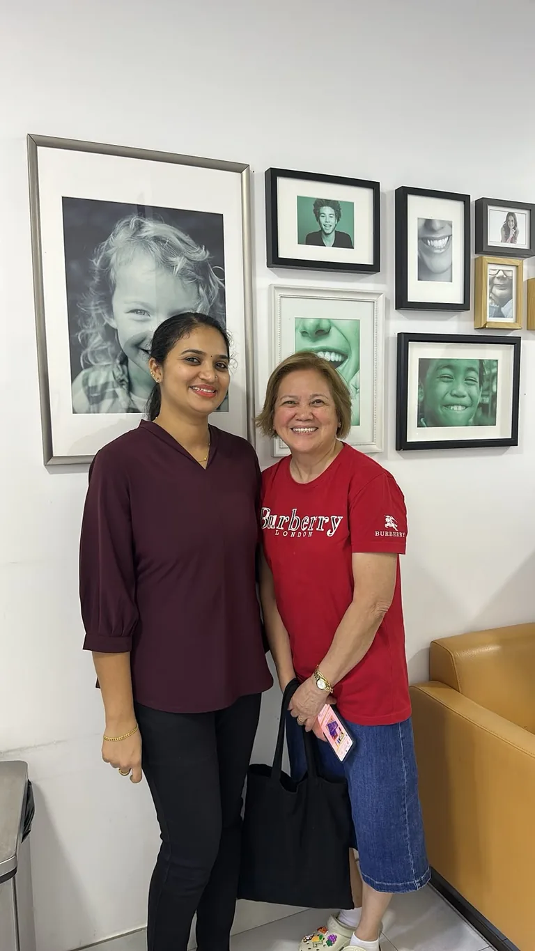 Dr Deepthi Chandran Rajeesh, specialist orthodontist, with a patient at Best Dentist in Al Rigga, Dubai