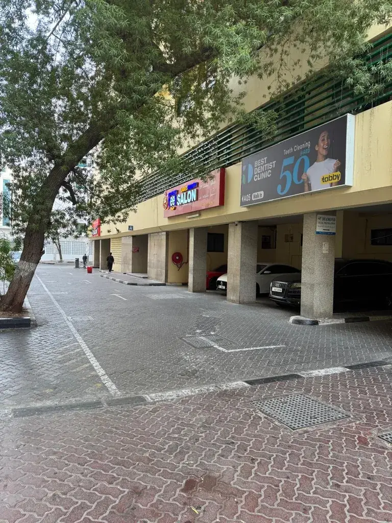 Al Owais Building seen from Al Rigga Road with the clinic parking area