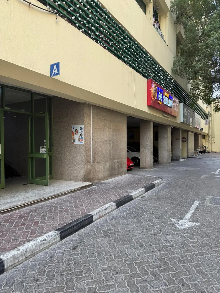 Block A entrance door with the blue A sign on the Al Owais Building