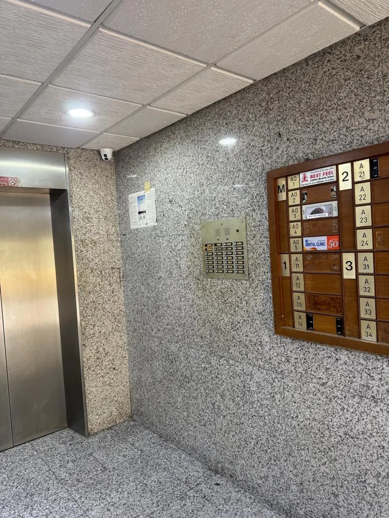 Lift lobby directory board showing Office M05 Dental Clinic