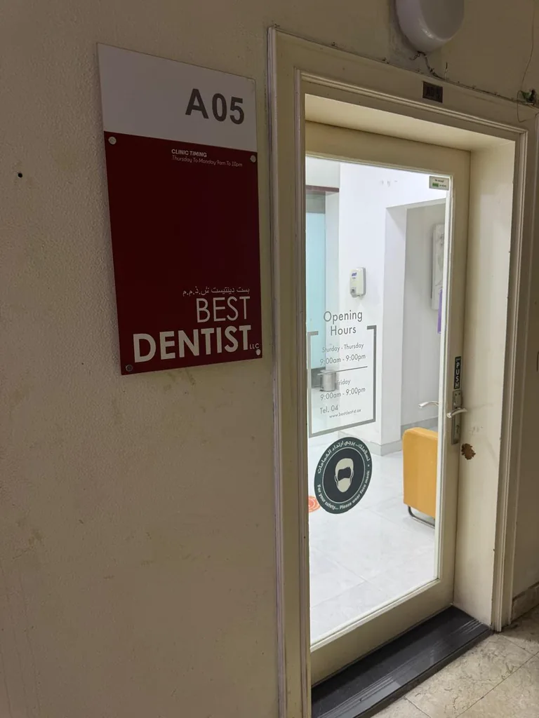 Best Dentist clinic door, Office M05, with the clinic timing sign